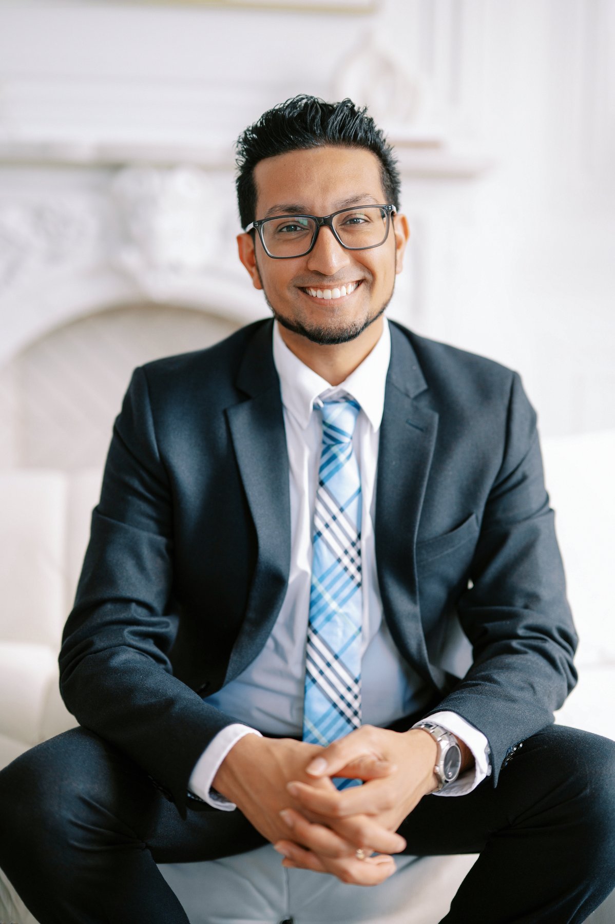 Randy Roopchan seated in a suit